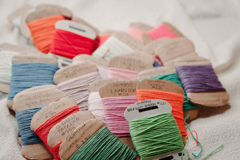 colorful embroidery thread, photo by Kayla Schiltgen